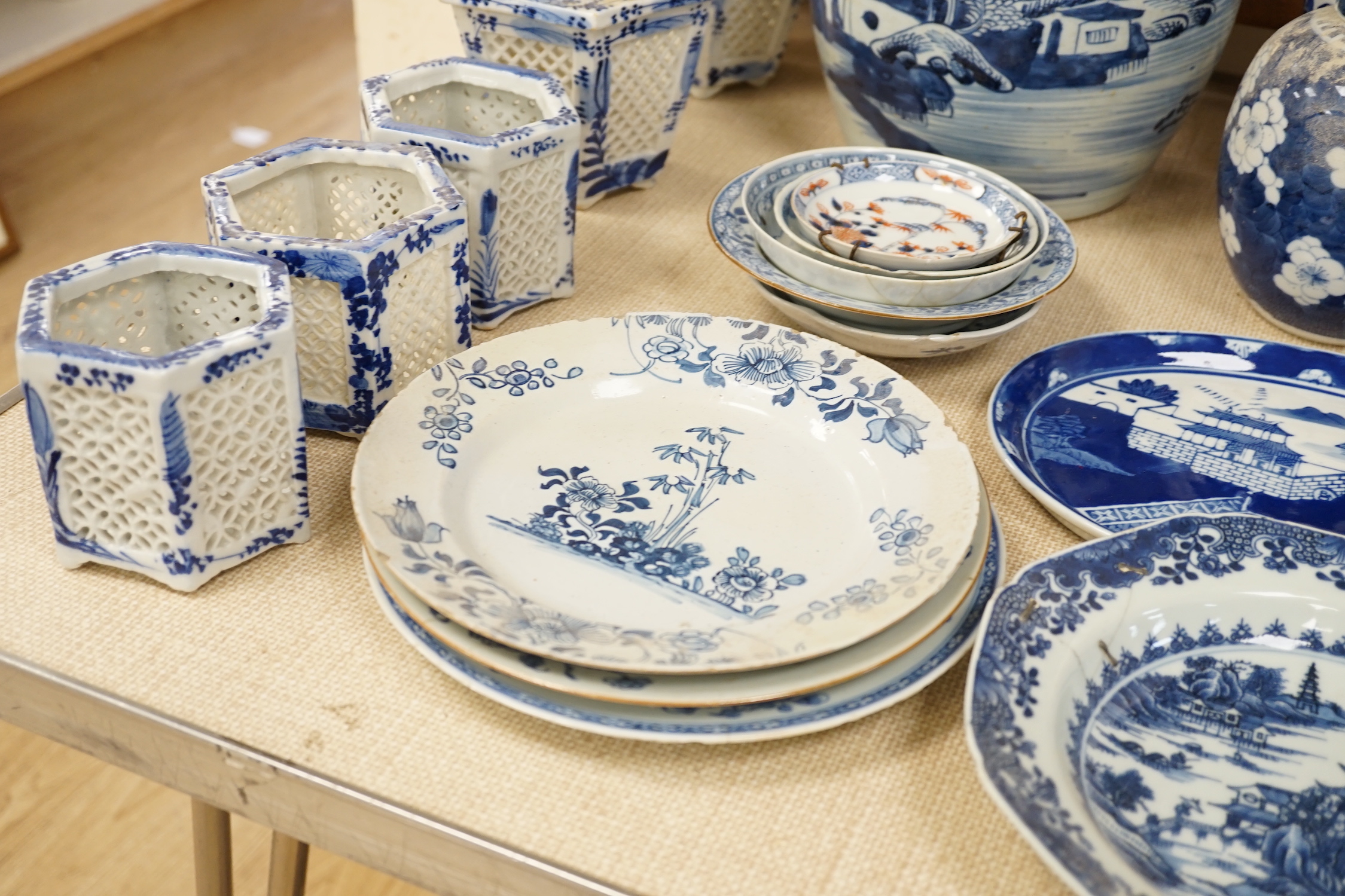 A large collection of Chinese blue and white export plates, a blanc de chine figure, two vases, a jar and five Japanese planters, jar 24cm high (a.f.)